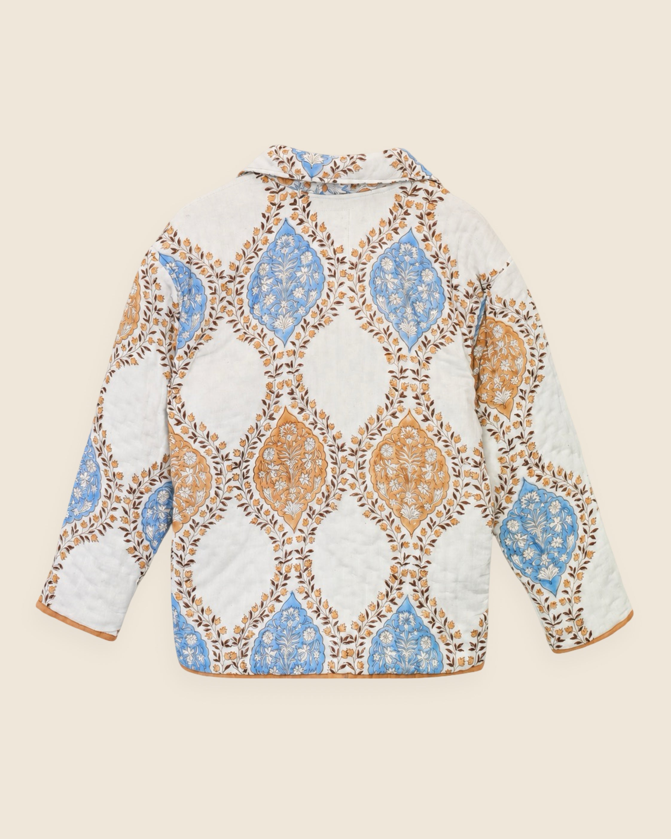 Back view of reversible quilted jacket showing hand-printed cotton pattern