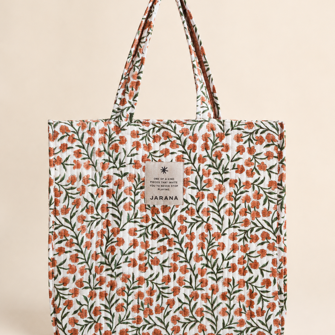 Soft quilted tote bag in natural cotton with hand block-printed floral pattern