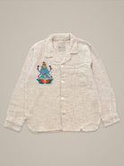 Handmade cotton shirt with embroidered depiction of blue Shiva sitting on a lotus β vibrant Jarana spiritual design