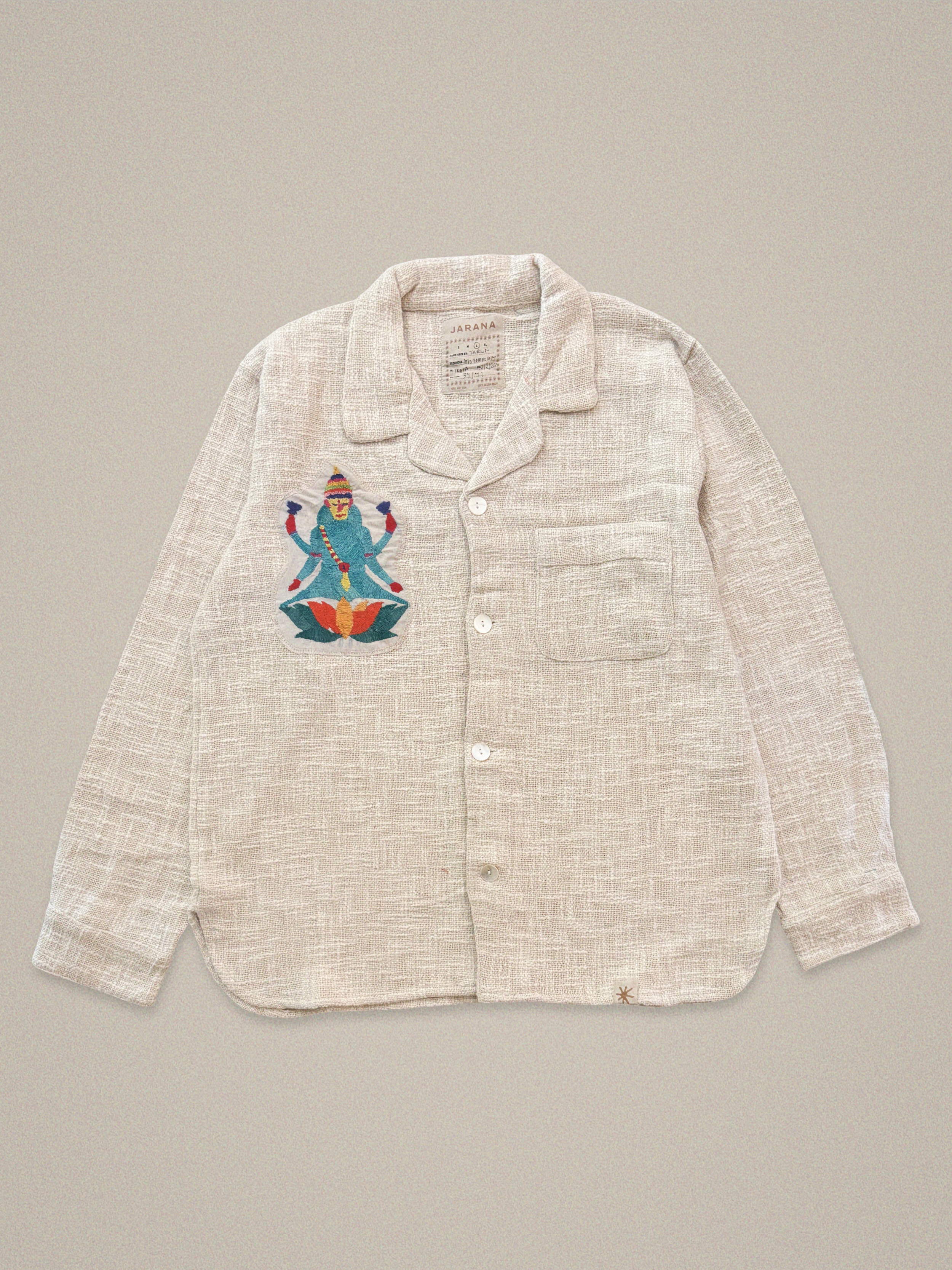 Handmade cotton shirt with embroidered depiction of blue Shiva sitting on a lotus β vibrant Jarana spiritual design