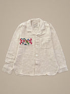Handmade natural cotton shirt with parrot and floral embroidery β vibrant Jarana design