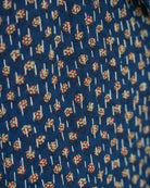 Detail of blue Kantha shirt with contrasting inner block print pattern and hand stitching