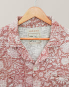 Detail of shirt collar and label reading “Jarana,” showcasing intricate Kantha stitching and fabric texture