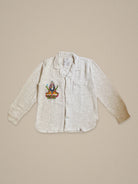 Handmade cotton shirt with embroidered depiction of Shiva sitting on a lotus β vibrant Jarana spiritual design