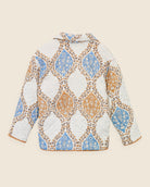 Back view of reversible quilted jacket showing hand-printed cotton pattern