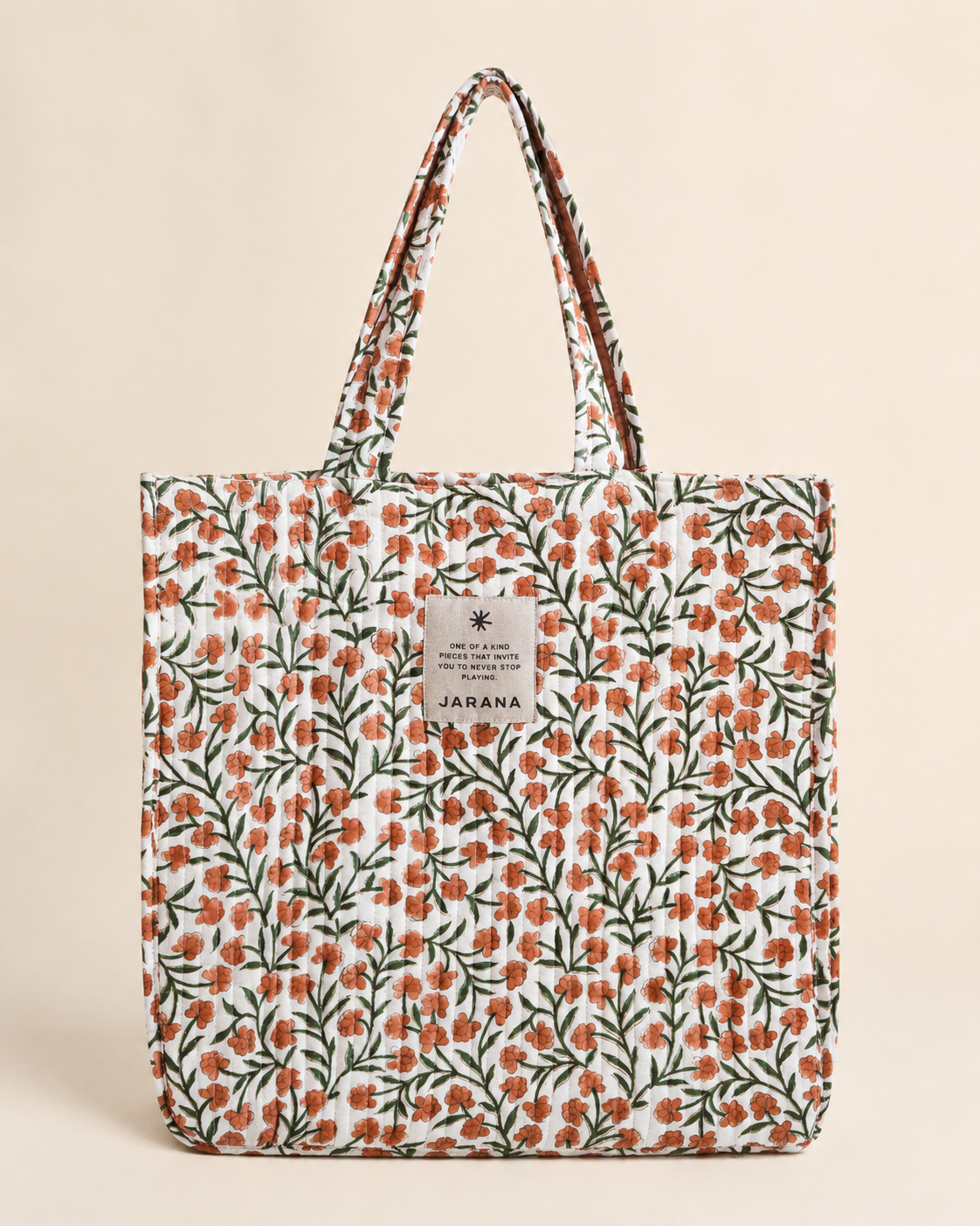 Soft quilted tote bag in natural cotton with hand block-printed floral pattern
