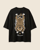 Black t-shirt with a tiger graphic and 'Jarana' branding on a beige background