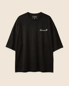 Black t-shirt with 'Jarana' logo on a beige background