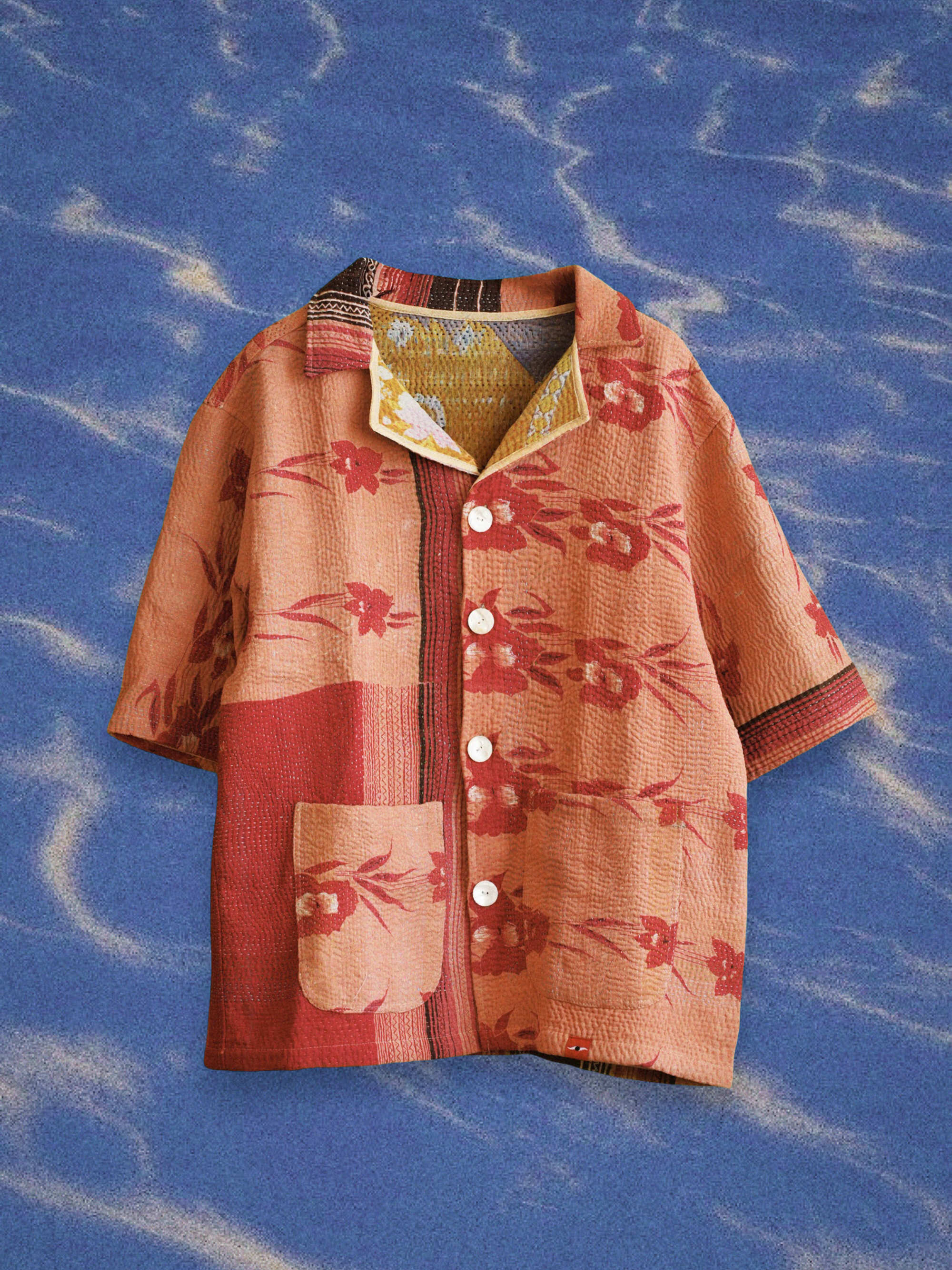 Vintage kantha shirt recut from Indian quilt fabric with faded patchwork surface