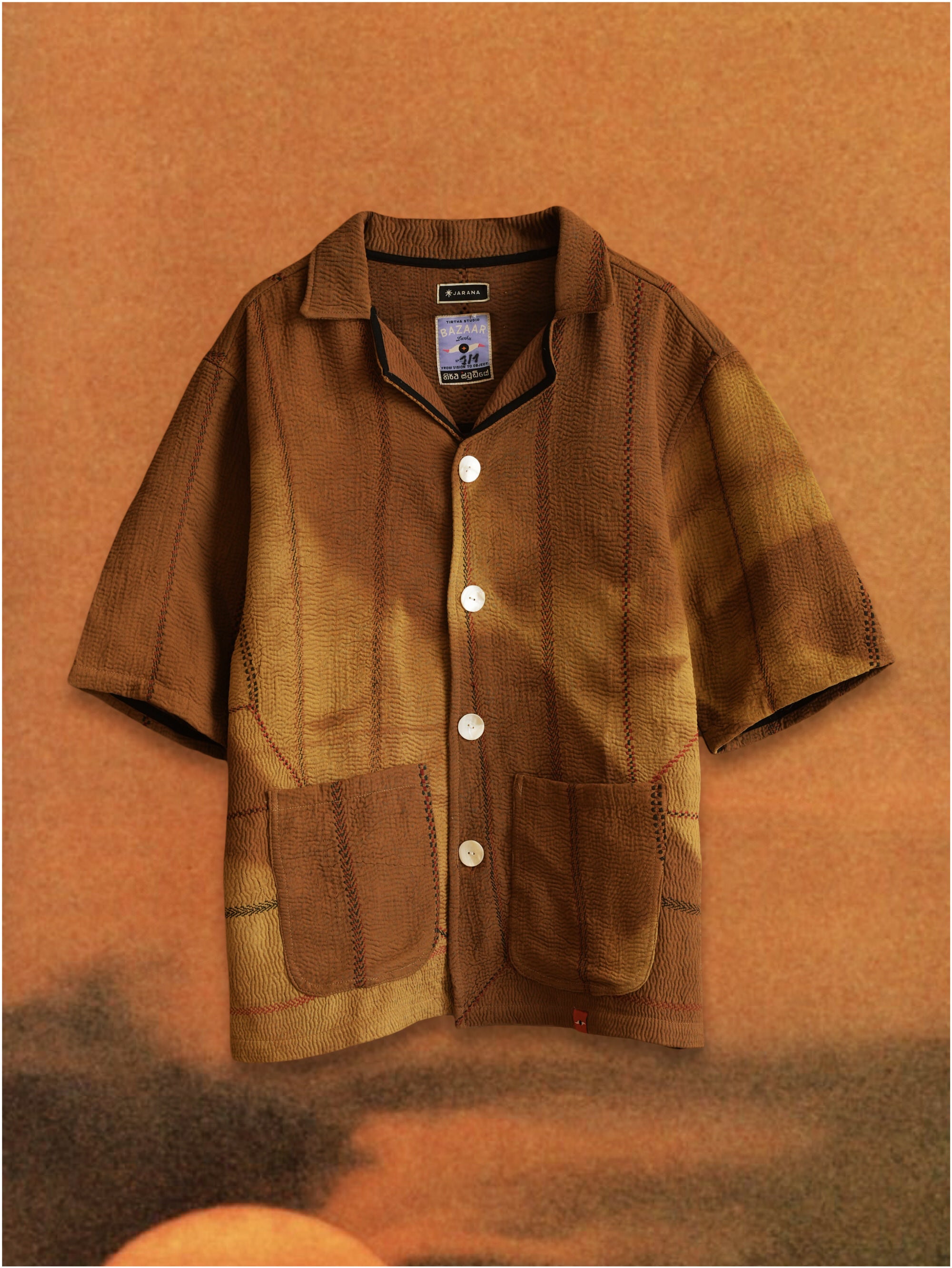 Vintage kantha jacket with hand-stitched quilting and naturally aged cotton fabric
