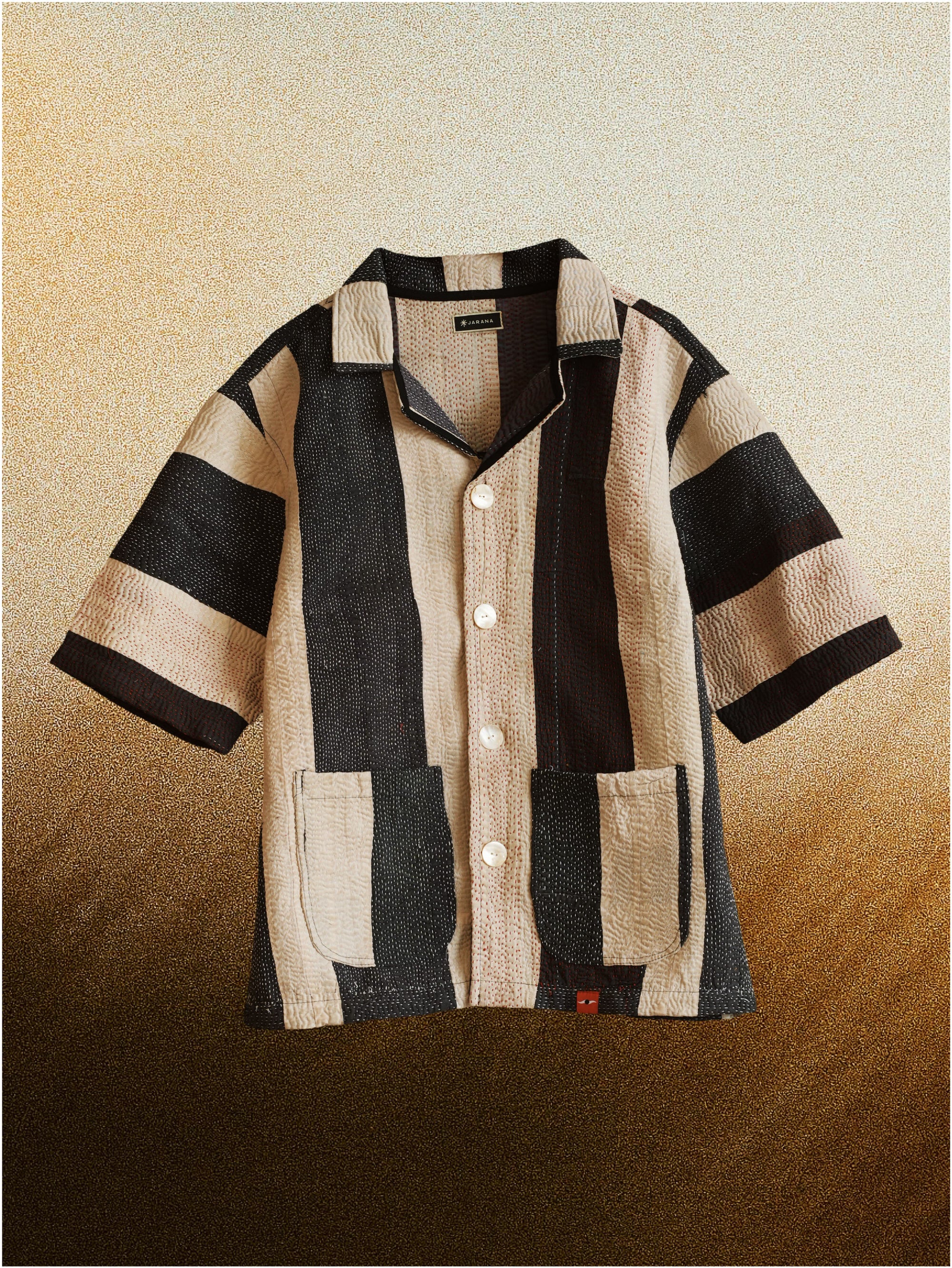 Vintage kantha jacket made from layered cotton textile with hand-stitched running lines