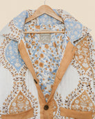 Floral patterned shirt on a hanger with visible brand label