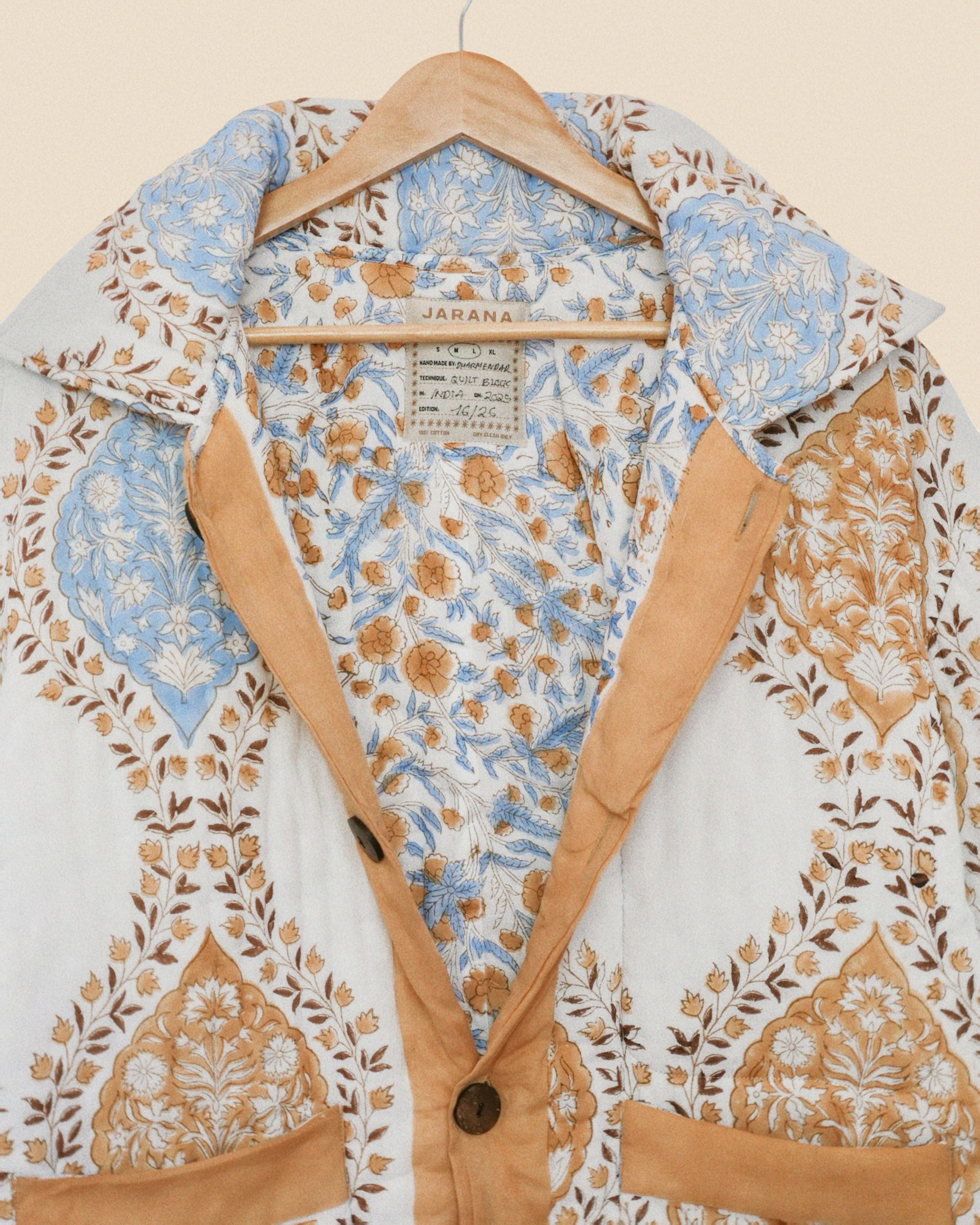 Floral patterned shirt on a hanger with visible brand label