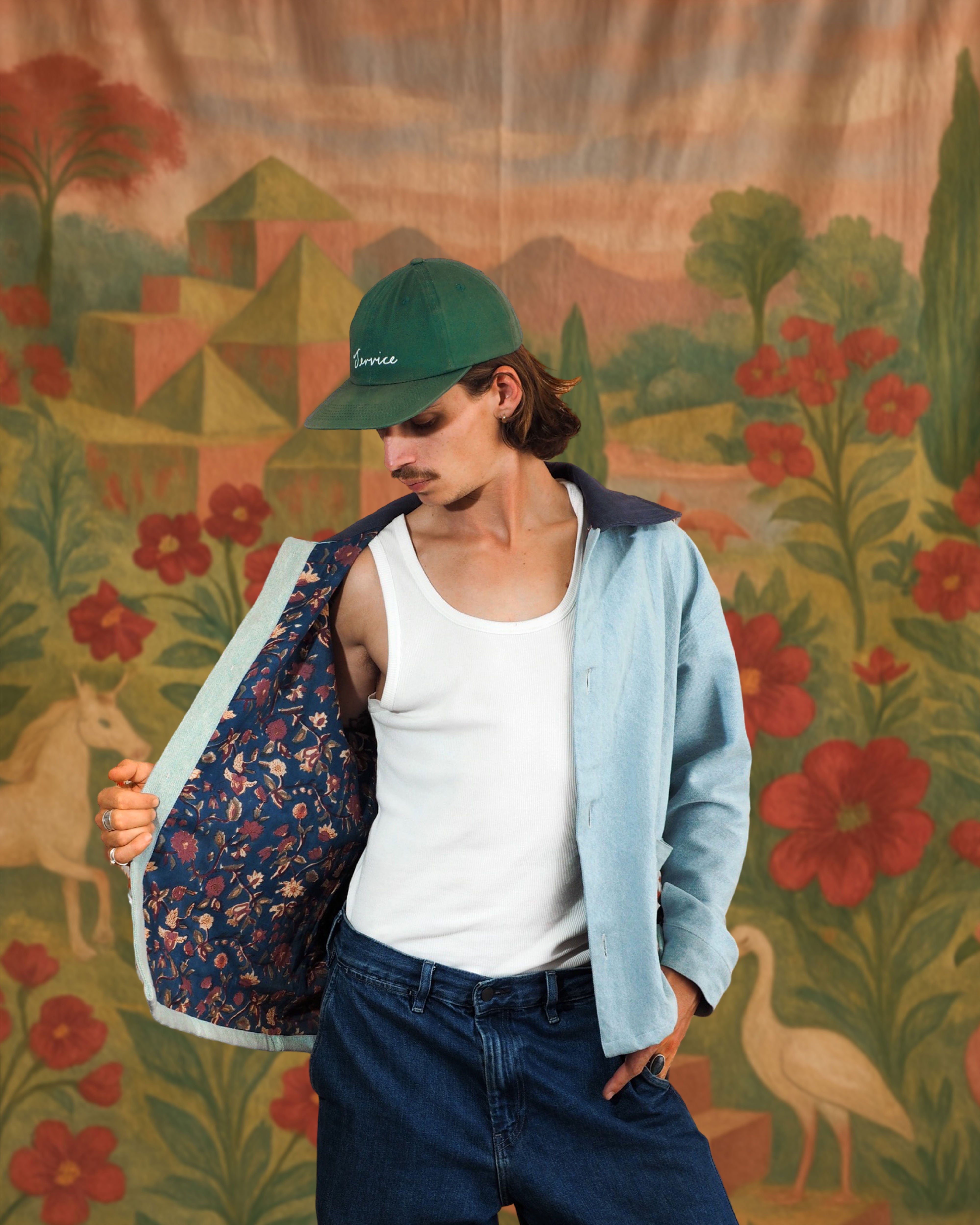 Model showing inside of light denim jacket with handcrafted blockprinted floral lining