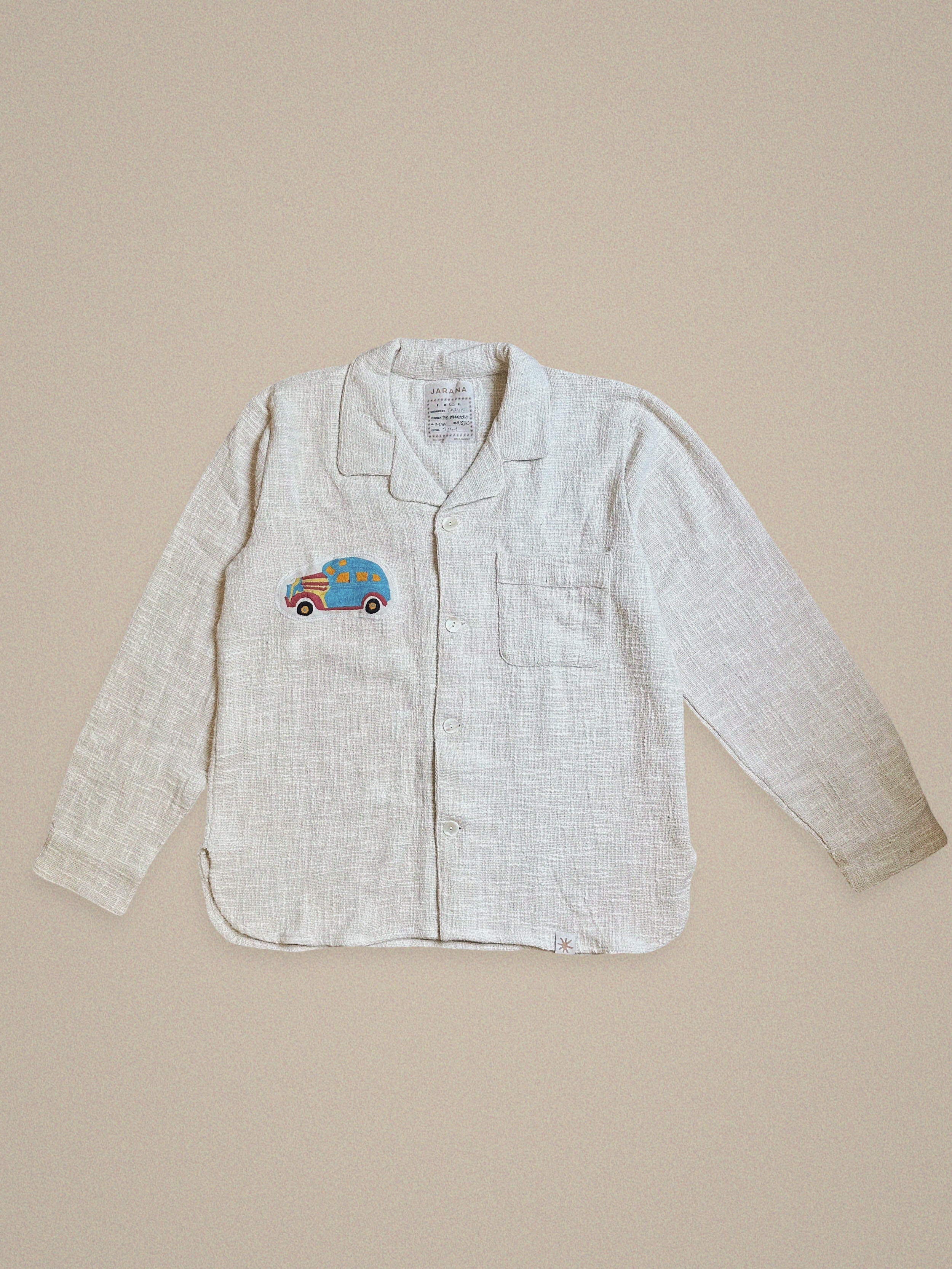 Handmade linen shirt with blue embroidered vintage car – whimsical design on textured fabric by Jarana