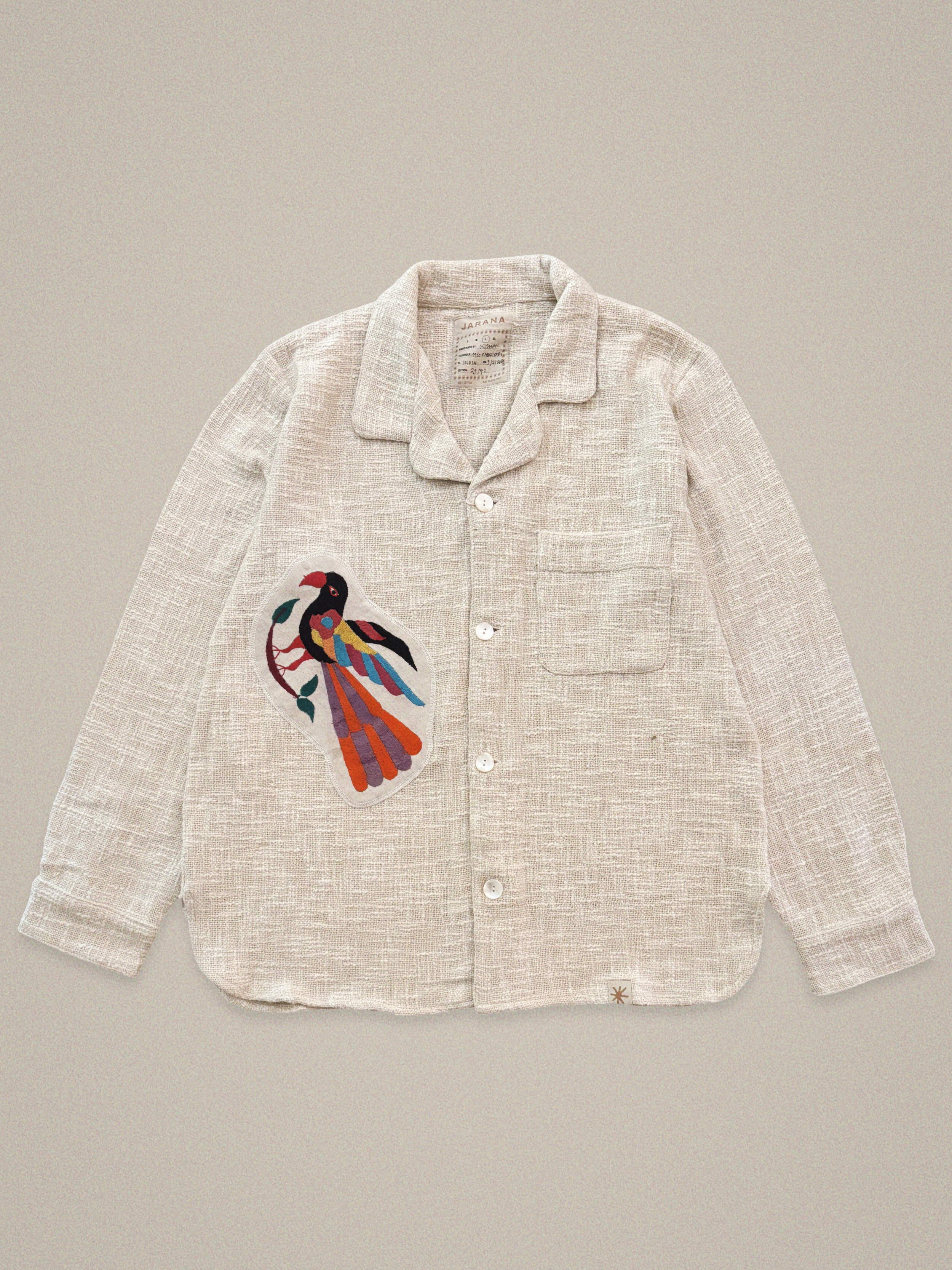 Handmade linen shirt with large colorful bird embroidery – vintage textile design by Jarana