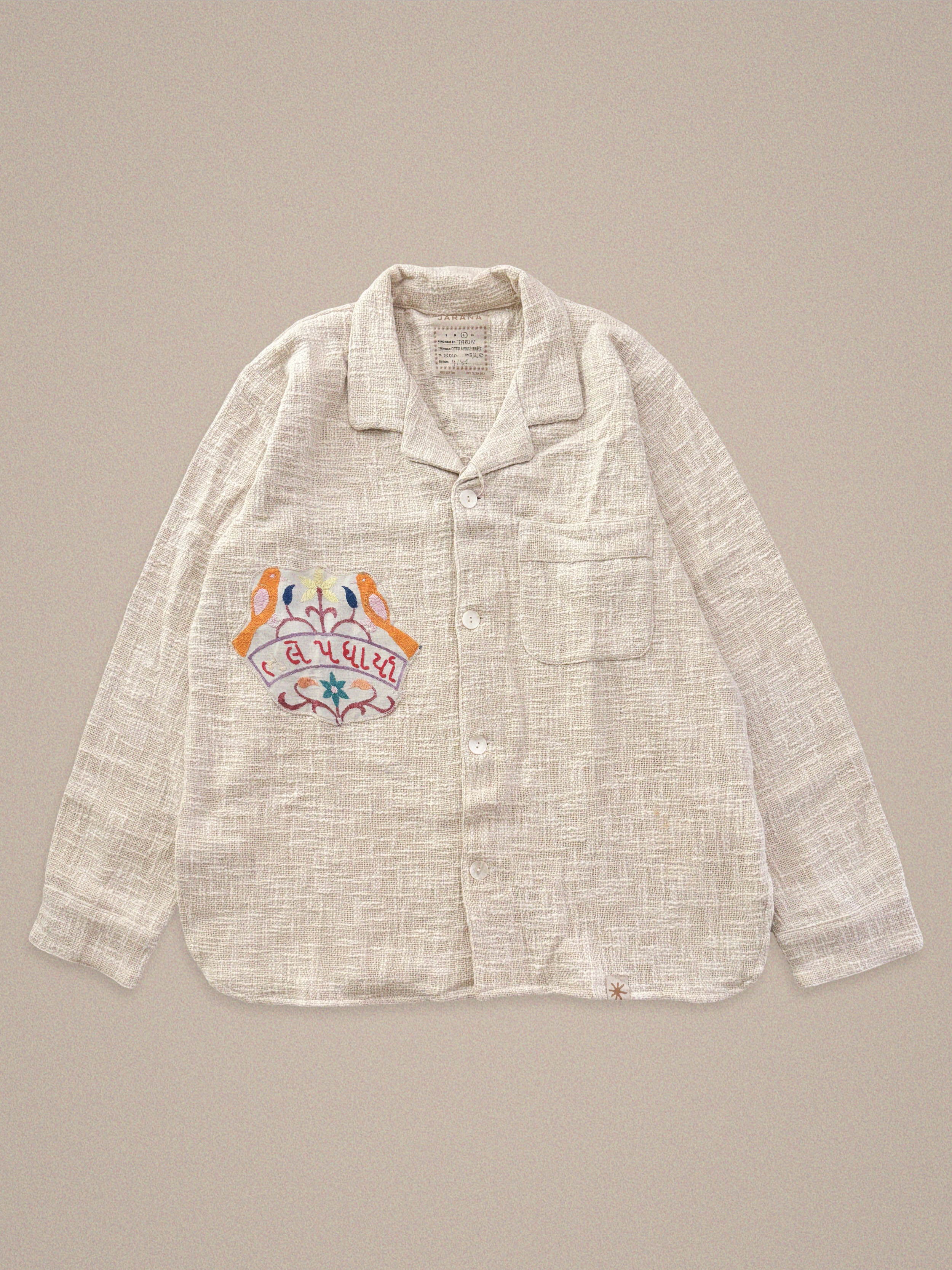 Handmade cotton shirt with Gujarati script and bird embroidery – cultural statement by Jarana