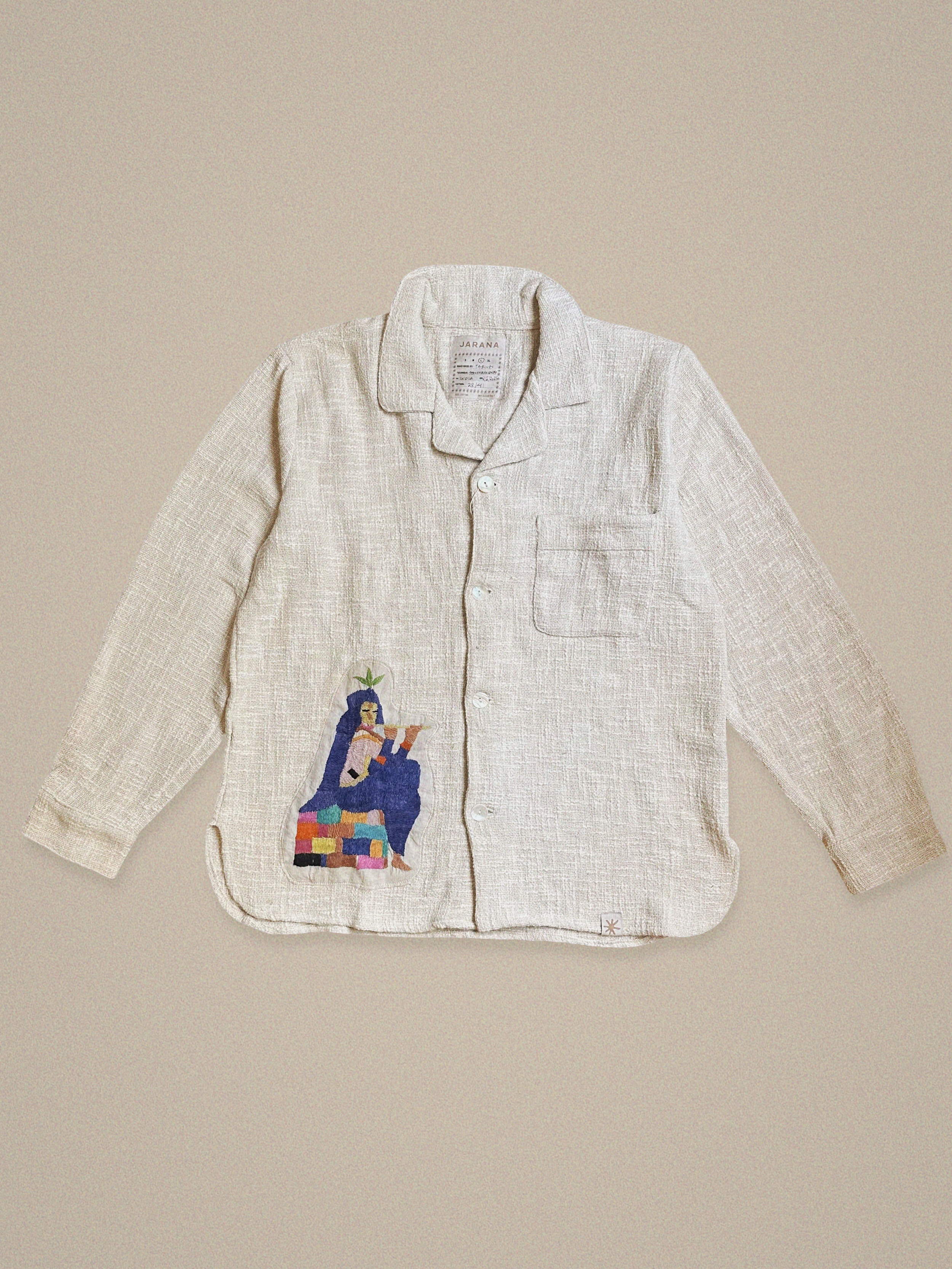 Handmade linen shirt featuring a seated Krishna figure with a plant headdress – crafted from vintage textiles by Jarana