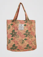 Peach-toned quilted tote bag featuring vintage floral block print in green and pink, handcrafted in India by Jarana.