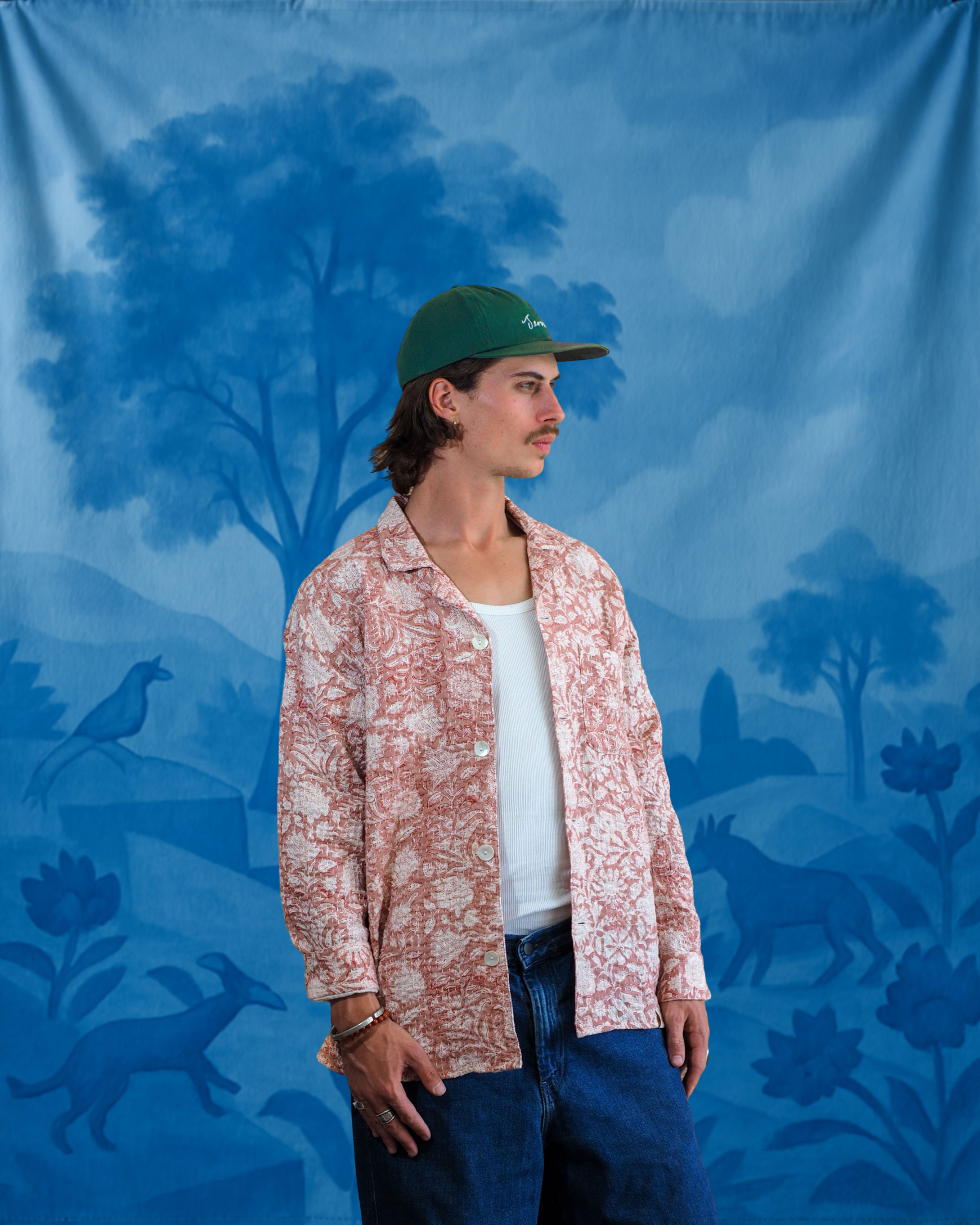 Model wearing a handcrafted Kantha shirt with floral embroidery and blockprint, front view