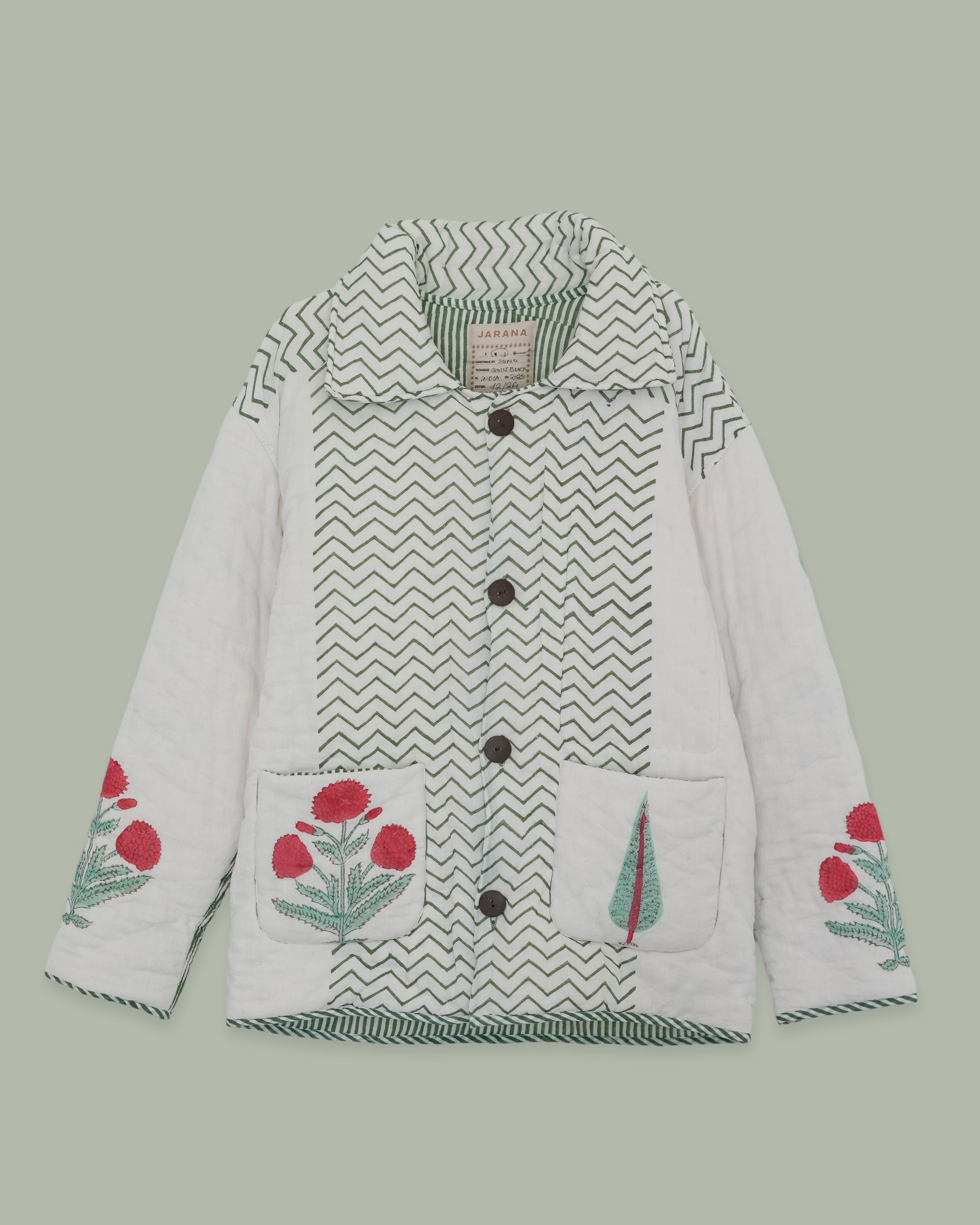 Hand blockprinted reversible quilted cotton jacket hanging, with floral motifs on front and sleeves